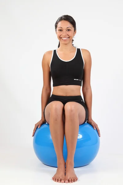Healthy young girl on exercise ball — Stock Photo, Image