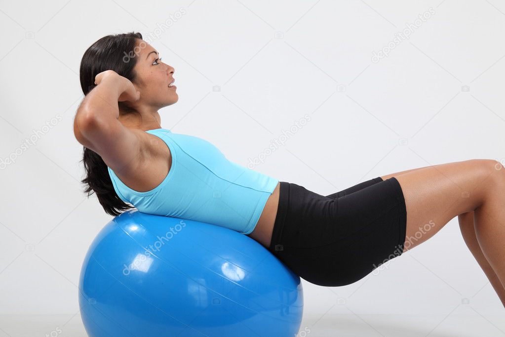Athletic girl doing crunches
