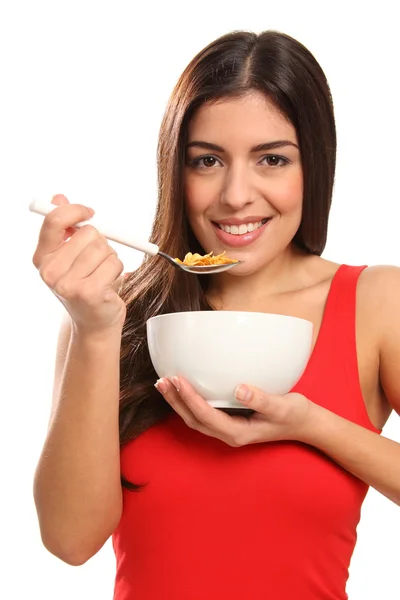Flickan ler äta frukostflingor — Stockfoto