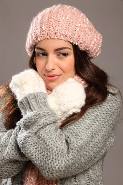 Girl in warm winter woollies looking away smiles — Stock Photo, Image