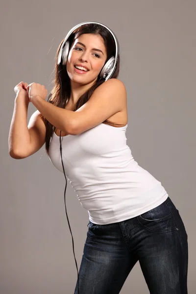 Girl dancing and singing to music — Stock Photo, Image