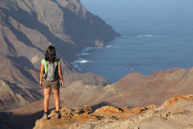 Hiker on top volcanic craters clipart