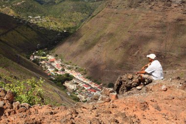 Hiker on hillside above Jamestown clipart