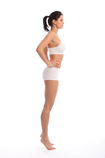 Sexy fit mladá žena v pohledu profilu spodní prádlo — Stock fotografie