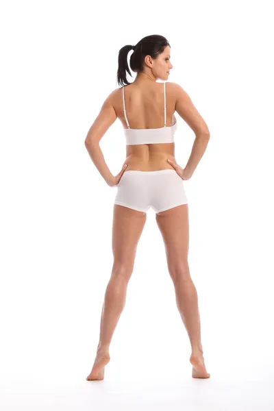 Vista posteriore bella donna in lingerie sportiva — Foto Stock