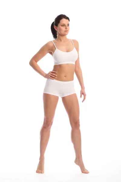 Schön fitte junge Frau steht weiße Unterwäsche — Stockfoto