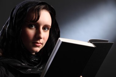 Bible study for religious young woman in headscarf clipart