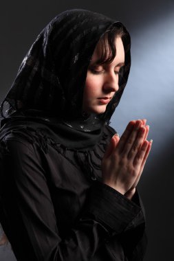 Religious woman meditating in spiritual worship clipart