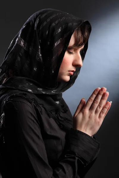 stock image Beautiful woman in headscarf praying eyes closed