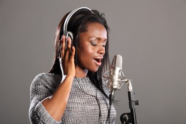 Making music beautiful black woman singing in mic clipart