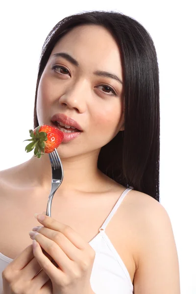 Sexy chinese teenager eats fresh strawberry fruit — Stock Photo, Image