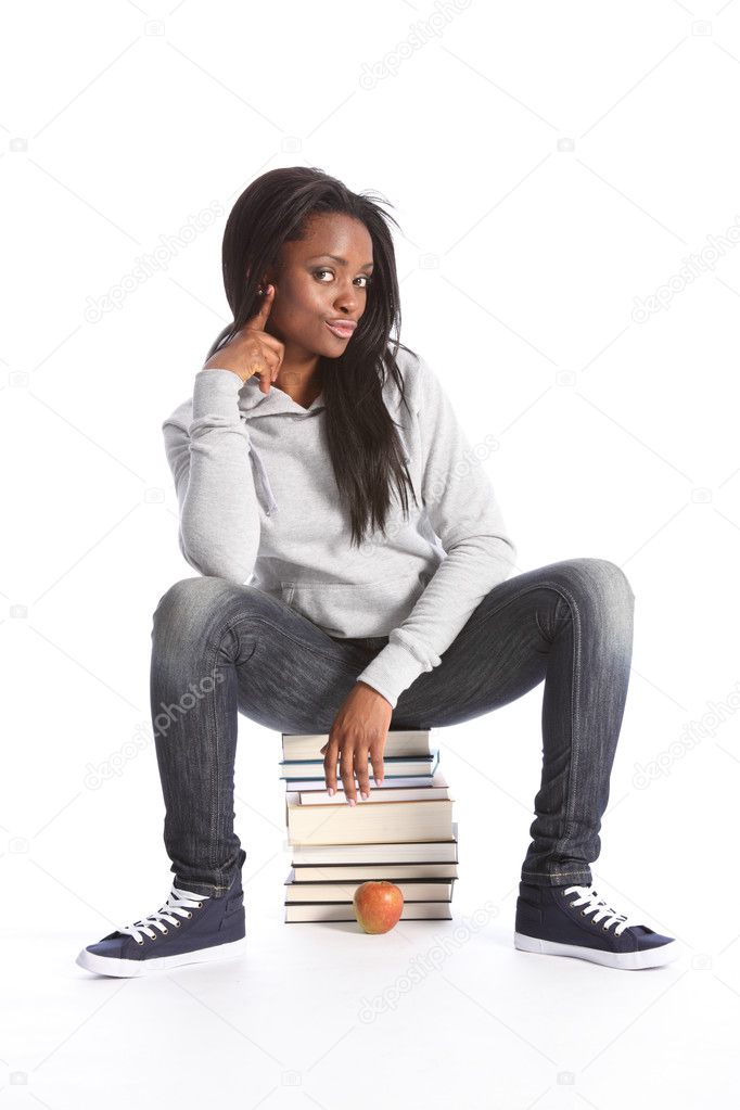 Black teenage student girl sits on education books