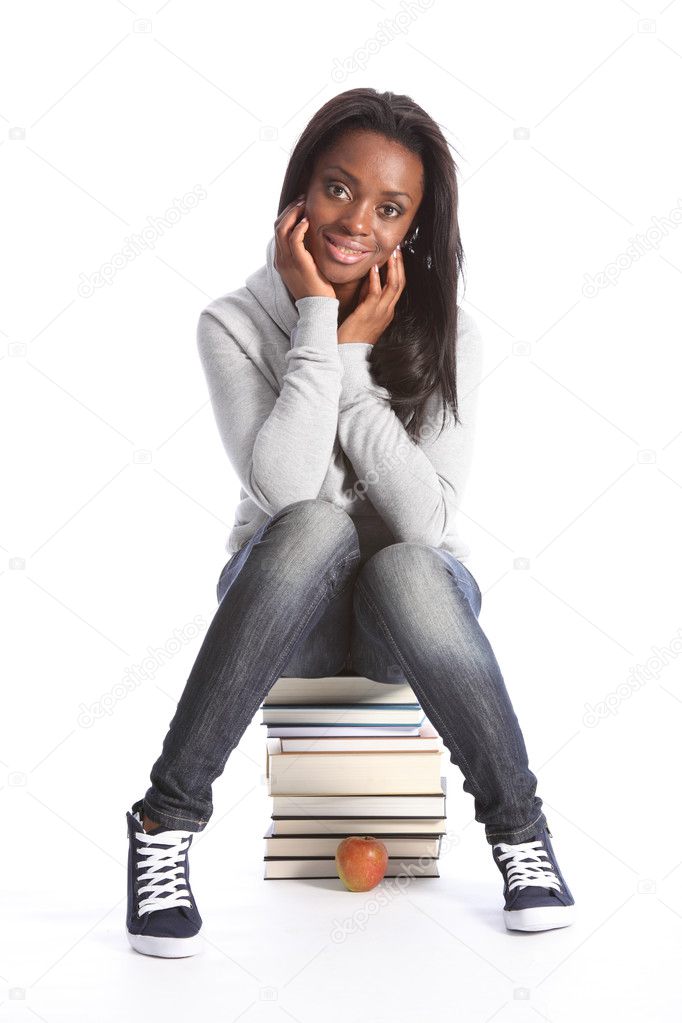 Happy young student girl with education books