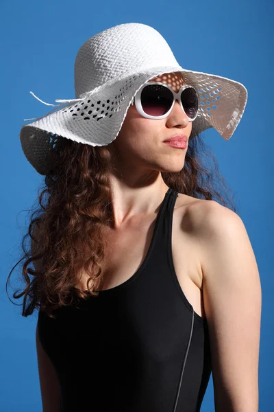 Beautiful woman in hot sun swimsuit shades and hat — Stock Photo, Image