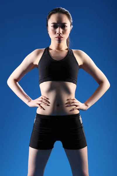 Young beautiful Chinese girl in fitness clothes — Stock Photo, Image
