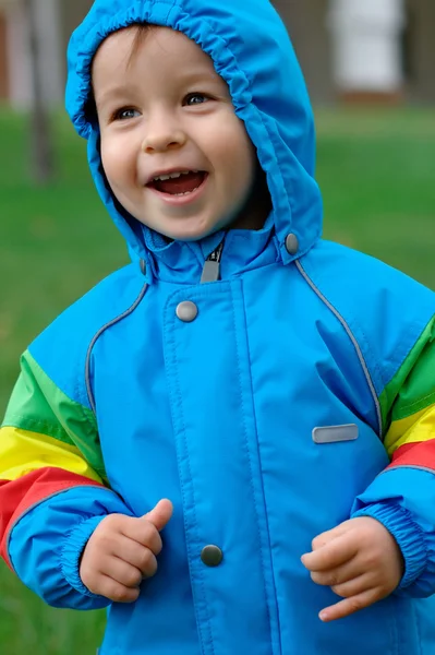 Baby in a raincoat — Stock Photo, Image