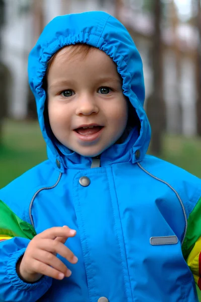Baby in a raincoat — Stock Photo, Image