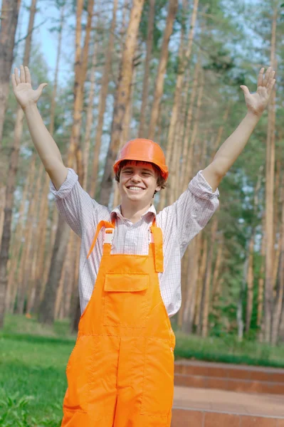 Happy worker with hands up outdoors — Stock Photo, Image