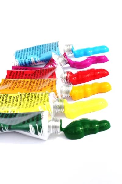 Colourful vertical acrylic paint squirts at angle — Stock Photo, Image