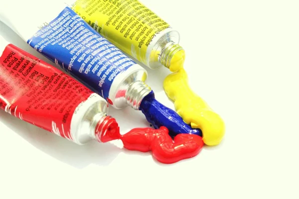 Horizontal primary colour paint tubes sqeezed out — Stock Photo, Image