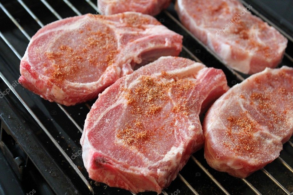 Seasoned raw pork chop cutlets Stock Photo by ©hoppe-art 5973791