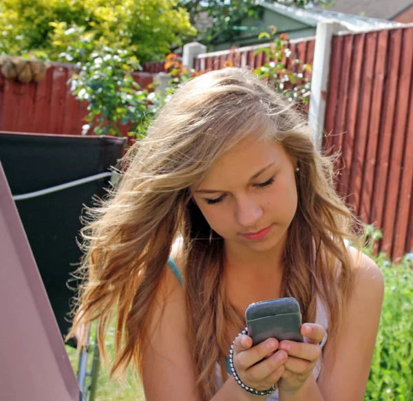 stock image Girl texting on mobile phone