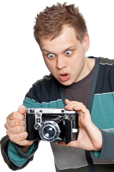 A young man with an antique camera — Stock Photo, Image