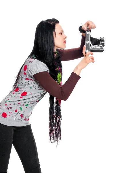 Brunette met een antieke camera — Stockfoto