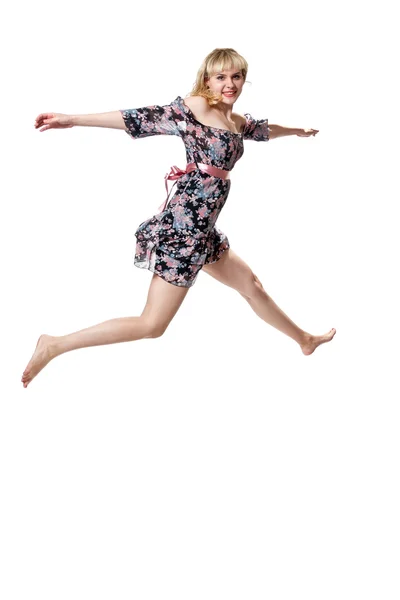 Uma menina em um salto largo — Fotografia de Stock