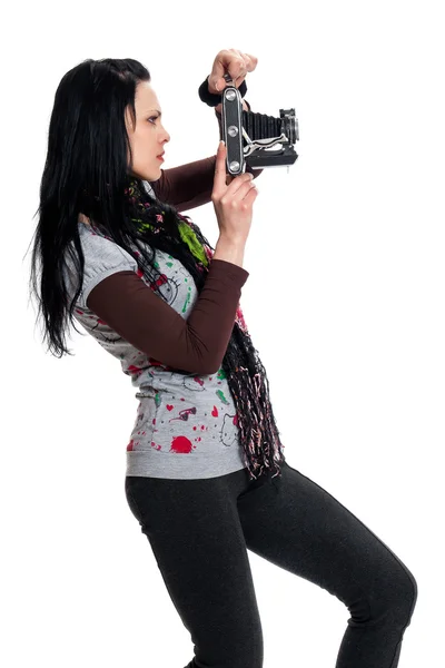 Brunette avec une caméra antique Image En Vente