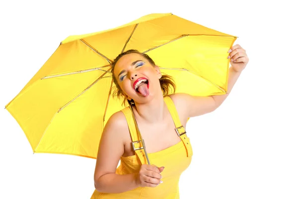 Meisje in geel en gele paraplu Stockfoto