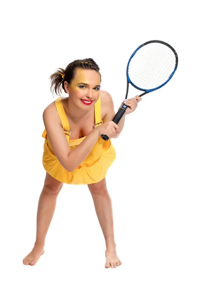 Menina em amarelo com uma raquete de tênis Fotografias De Stock Royalty-Free