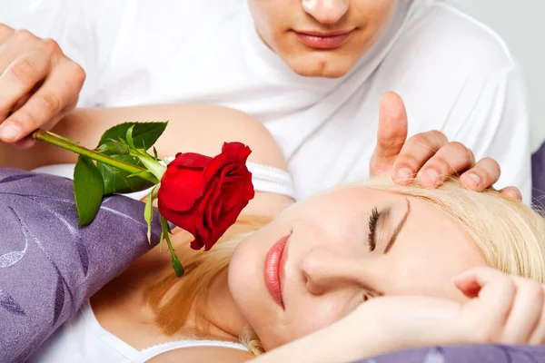 Couple rose male waking female — Stock Photo, Image