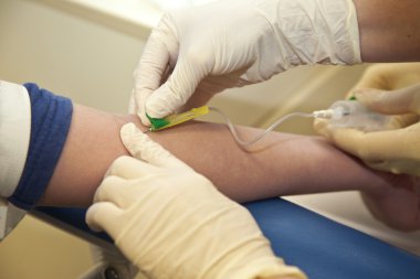 Nurse taking blood from a child clipart