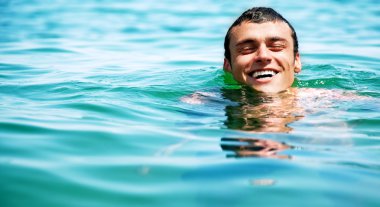 Man swimming in sea clipart