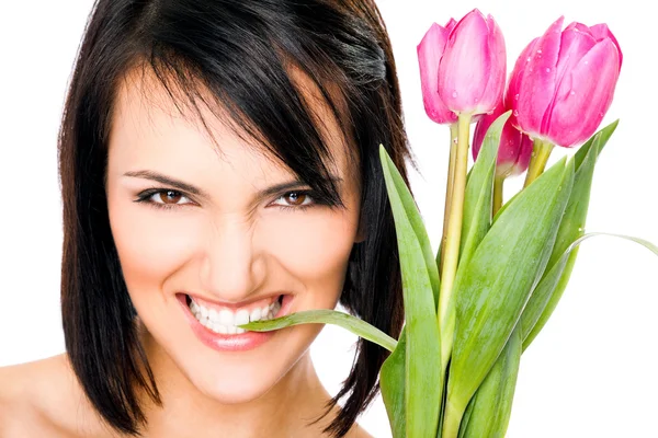 Kvinnliga bitande tulip blad — Stockfoto