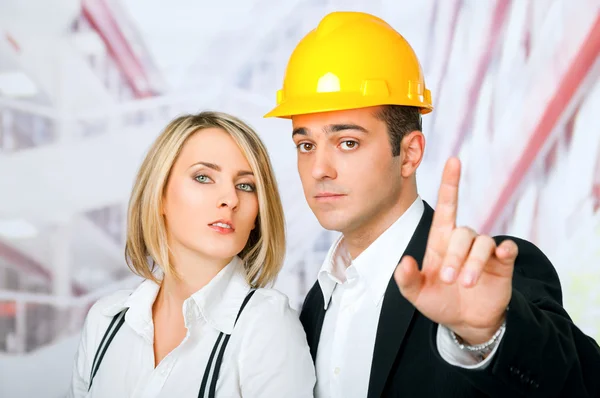 Male female architects pointing — Stock Photo, Image