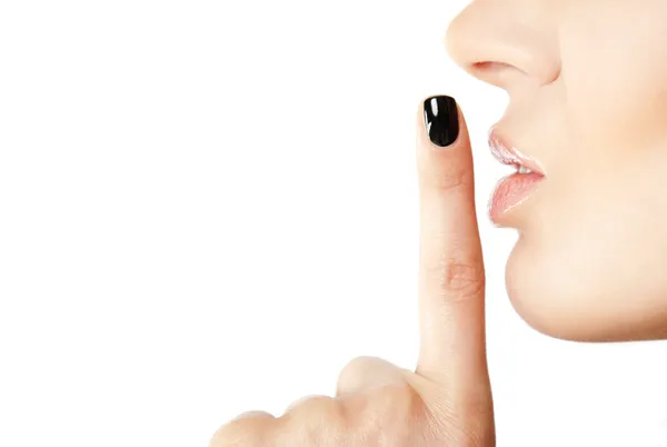 Vrouwelijke vinger stilte teken — Stockfoto