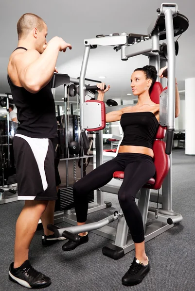Kvinnliga gym motion tränare — Stockfoto