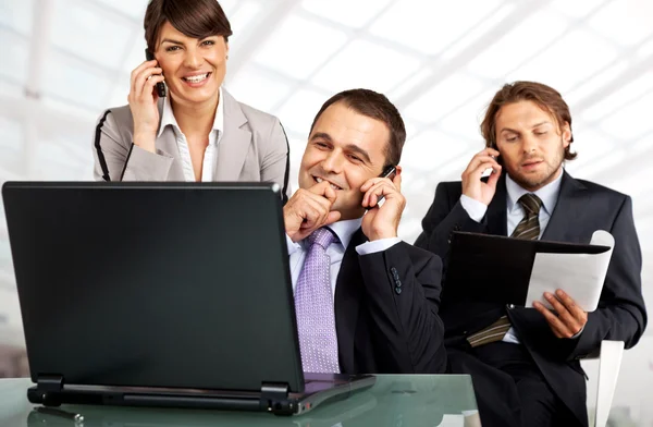 Successful team phones and laptop — Stock Photo, Image