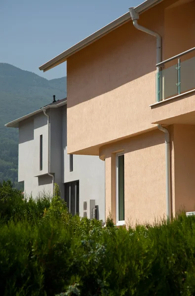 stock image Modern houses by the mountain