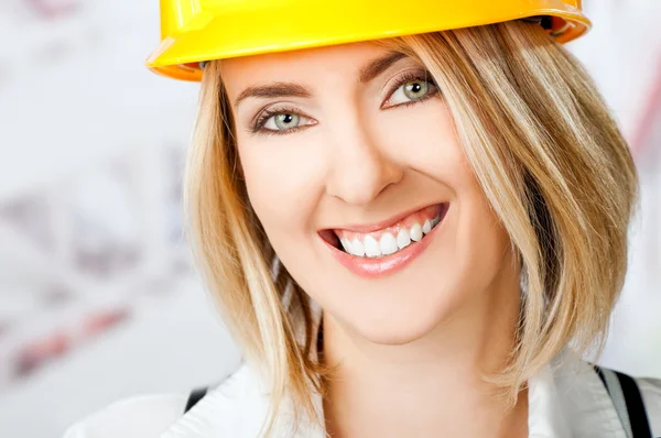 Female smiling hardhat Stock Picture