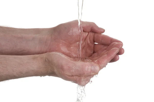 Water flows in hands — Stock Photo, Image