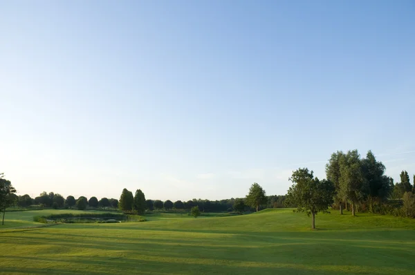 stock image Green landscape with blue sky