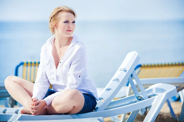 stock image Beautiful woman sitting in chaise