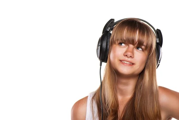 可爱的女孩在听音乐的耳机 — 图库照片