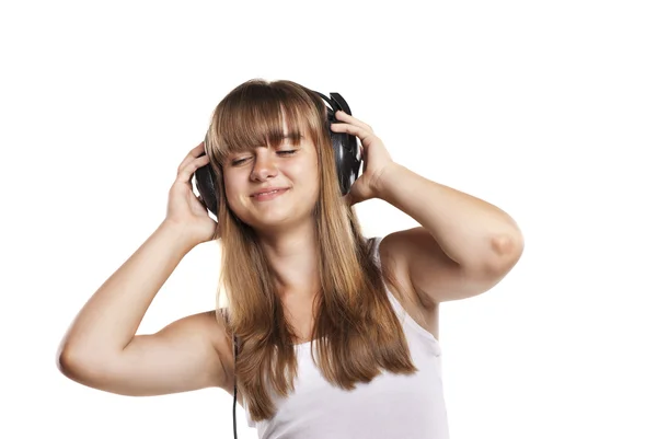 可爱的女孩在听音乐的耳机 — 图库照片