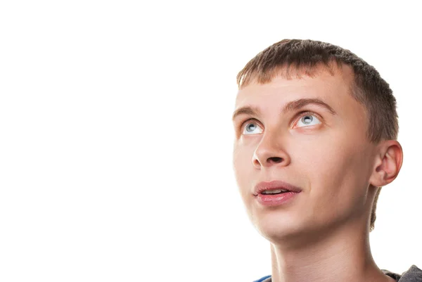 Young man looking at copyspace having a surprised look — Stock Photo, Image