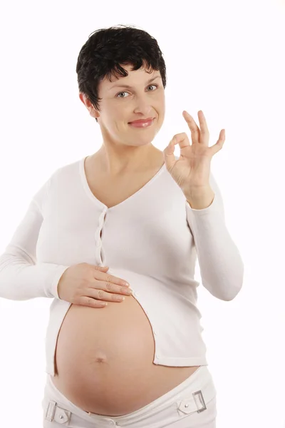 Een moeder van haar ongeboren kind praten en spelen met het — Stockfoto