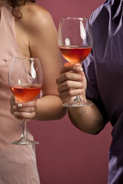 Couple sharing a glass of red wine — Stock Photo, Image